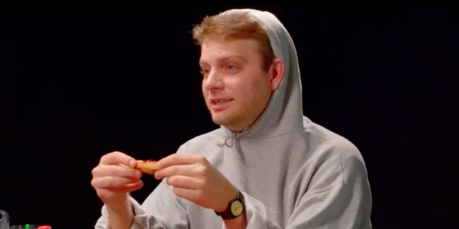 Watch Mac DeMarco Get Interviewed About Farts, Gap Teeth, More While Eating Hot Wings 