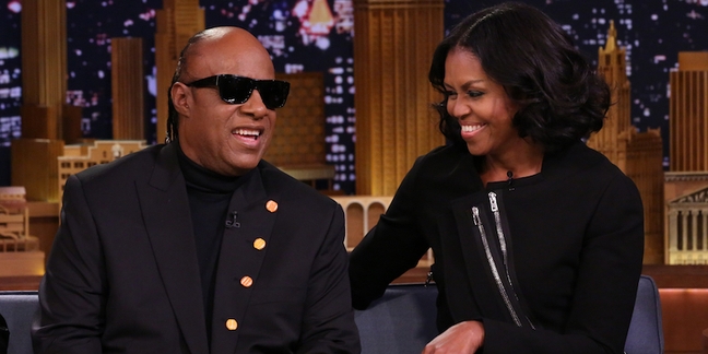 Watch Michelle Obama Play “Catchphrase” With Dave Chappelle and Seinfeld, Get Serenaded by Stevie Wonder