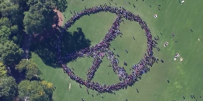 Yoko Ono Organizes Giant Human Peace Sign for John Lennon's 75th Birthday