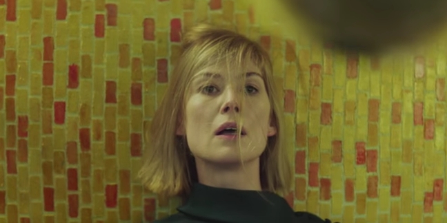 Massive Attack and Young Fathers Share Sinister "Voodoo in My Blood" Video Starring Rosamund Pike